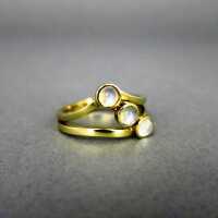 Ring with moon stone trio in gold and silver