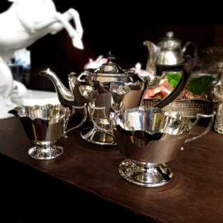 Elegant tea set with wooden handles