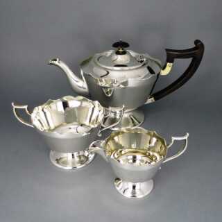 Elegant tea set with wooden handles