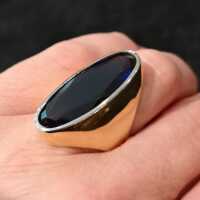 Magnificent gold ring with a huge faceted synthetic sapphire