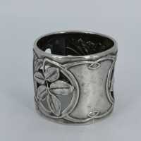 Art nouveau napkin ring in silver with floral relief decoration