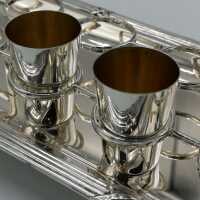 Set of 12 shot glasses on original tray in silver
