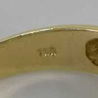 Ausgefallener Bandring in Gold mit einem Peridot und Brillanten