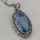 Art nouveau pendant in silver with sky blue spinel