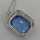 Art Deco silver pendant with a sky blue glass stone