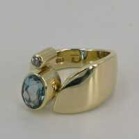 Designer ring in gold with an ocean blue aquamarine and a diamond