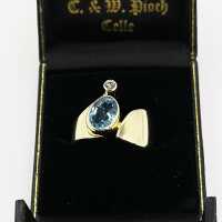 Designerring aus Gold mit einem ozeanblauen Aquamarin und einem Diamanten