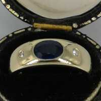 Eleganter Bandring aus Gelbgold mit einem Saphir und zwei Diamanten