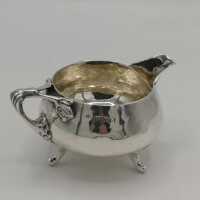 Antique silver tea service in Arts and Crafts style