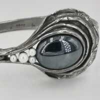 Perli designer silver bangle with a haematite