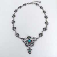 Vintage traditional silver necklace with openwork elements and turquoises
