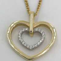 Necklace with double heart pendant in yellow and white gold with diamonds