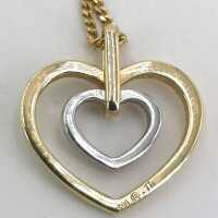 Necklace with double heart pendant in yellow and white gold with diamonds