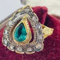 Art Nouveau ladies ring in gold and silver with an emerald and diamonds