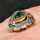 Art Nouveau ladies ring in gold and silver with an emerald and diamonds