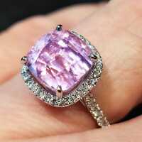 Elegant ladies ring in white gold with a kunzite and pale pink diamonds