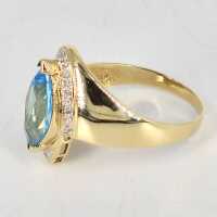 Vintage abstract ladies ring in yellow gold with blue topaz and diamonds