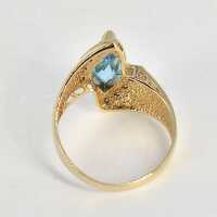 Vintage abstract ladies ring in yellow gold with blue topaz and diamonds