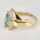 Vintage abstract ladies ring in yellow gold with blue topaz and diamonds