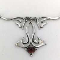 Vintage necklace in 925 silver with filigree elements and a garnet