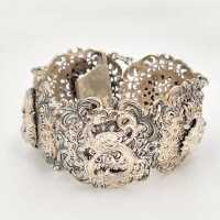 Vintage silver bracelet in baroque style with ornately decorated links