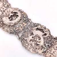 Vintage silver bracelet in baroque style with ornately decorated links