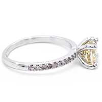 Elegant ladies ring in 14-karat white gold with a yellow natural diamond