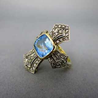 Cross shaped ring with aquamarine and diamonds