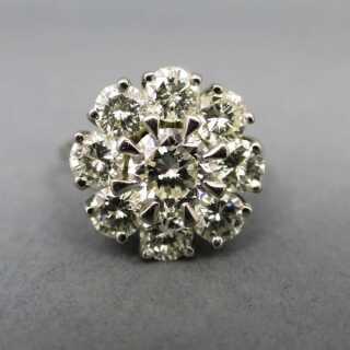 Precious engagement ring in white gold with a large flower of diamonds