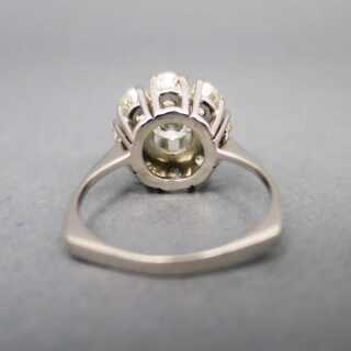 Precious engagement ring in white gold with a large flower of diamonds