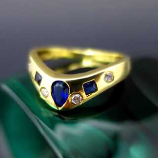 Bent ladys ring with sapphire and diamonds