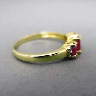 Gold ring with three rubies and diamonds