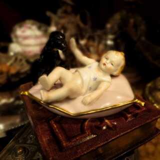 Porcelain figure baby with dog Thuringia Sitzendorf