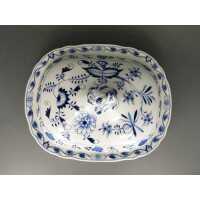Antique porcelain serving bowl with blue onion pattern...