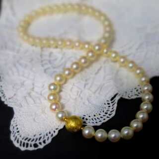 Beautiful necklace made of large Akoya pearls with gold clasp