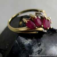 Delicate gold ring with rubies and zirconiums
