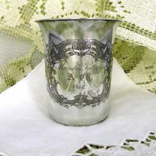 Silver christening mug with engraved decor