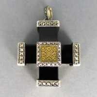 Black onyx cross pendant in silver and gold mounting