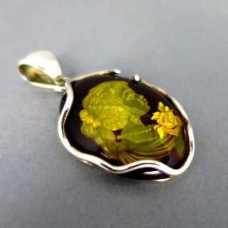 Pendant with amber gem in sterling silver mounting