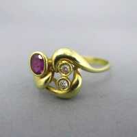 Gold ladys ring with ruby and two diamonds
