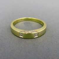Gold band ring with small diamond inlays