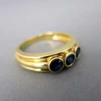 Ladys gold band rig with three sapphire stones vintage...