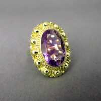 Gold ring with a huge amethyste stone