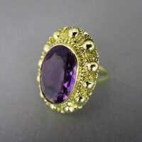 Gold ring with a huge amethyste stone