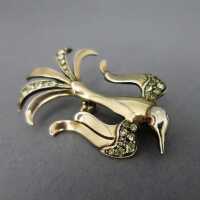 Beautiful bird brooch in silver and gold with glas paste...