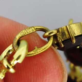 Antique gold link bracelet with deep red garnet stones