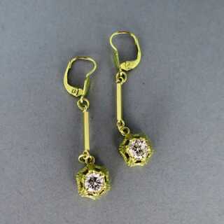 Beautiful long womens earrings in gold set with large diamonds