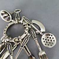 Silberner Schlüsselanhänger mit Charms