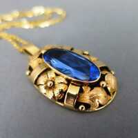 Big late Art Deco gold oval pendant with deep blue blue topaz inclusive chain