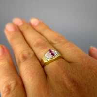 Elegant ladys vintage ring in gold with rubies and diamonds interesting design